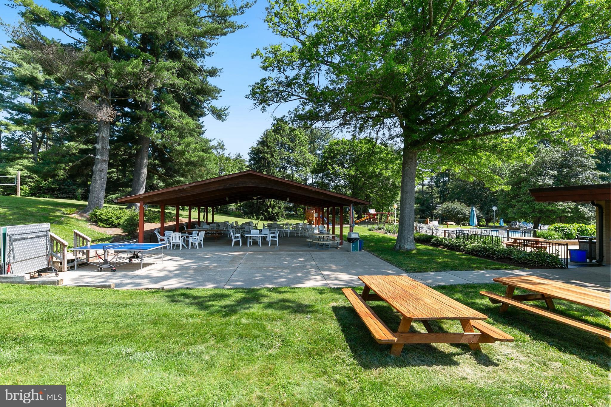 3004 Bluff Point Lane Silver Spring, MD 20906 - Photo 66 of 74 a view of a table and chairs under an umbrella in the garden