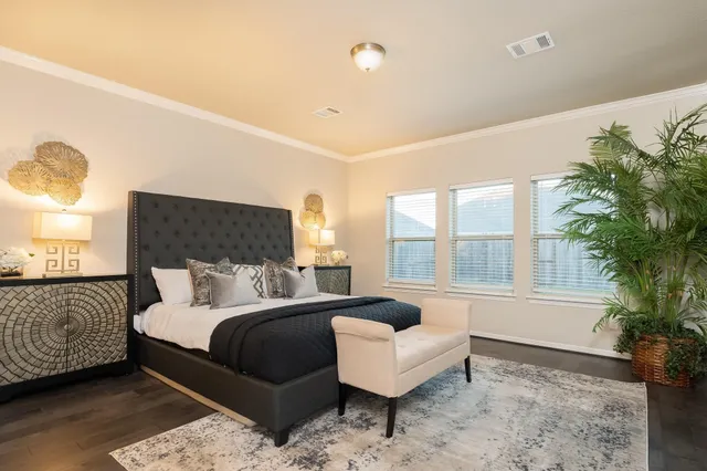 a bedroom with a bed and a couch