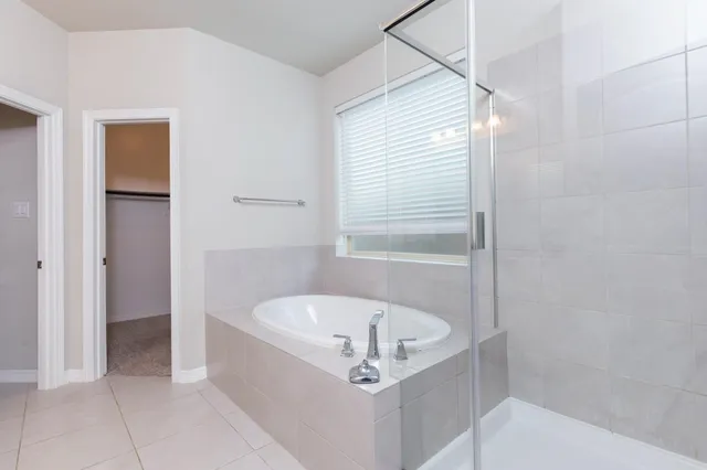 a white bath tub sitting in a bathroom