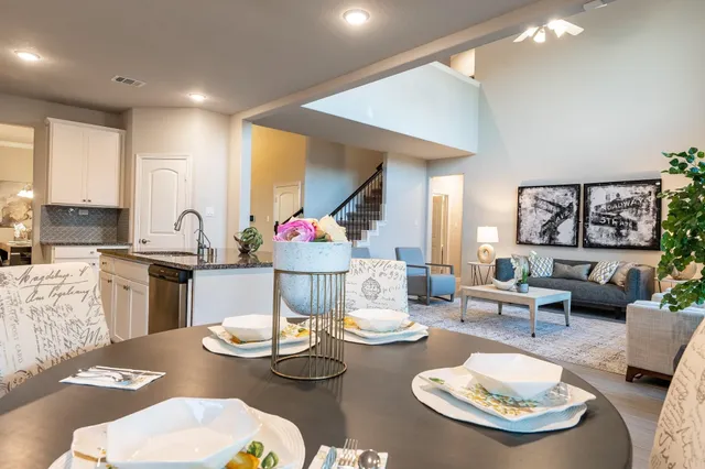 a kitchen with furniture and a table