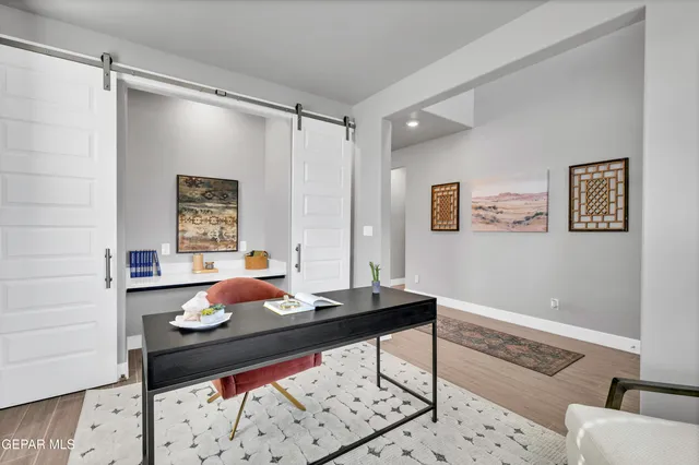 a living room with a couch and next to a window