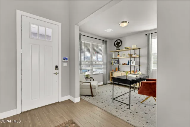 a living room with furniture and a window
