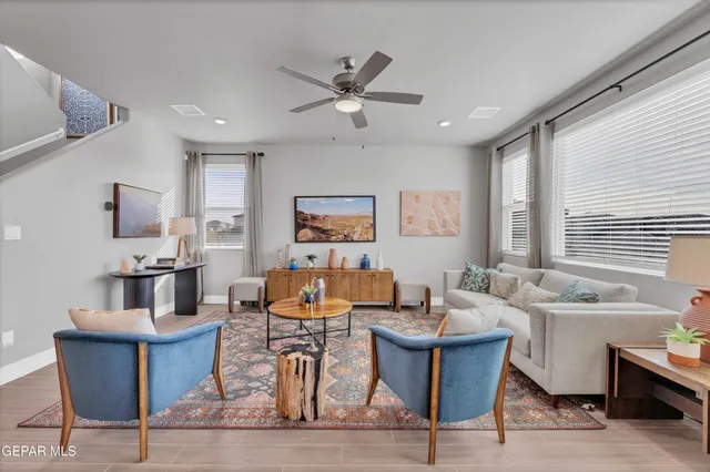 a living room with furniture and a large window