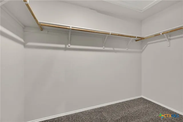 a view of a room with shelf on the wall