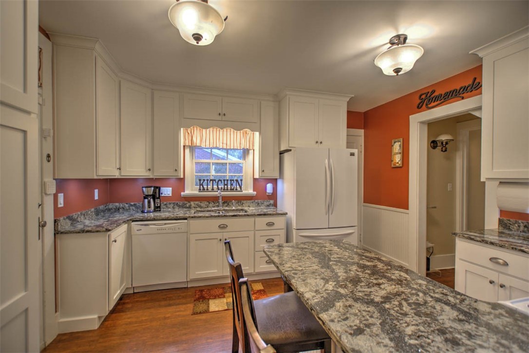 266 Cobb Avenue Decatur, IL 62522 - Photo 17 of 35 a kitchen with a stove a sink and a refrigerator