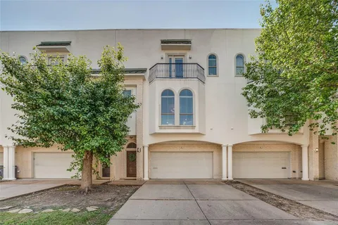 a front view of a house with a garage