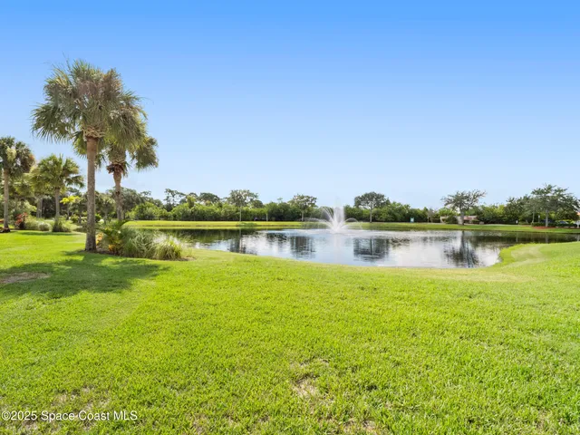 a view of a lake with houses in the background