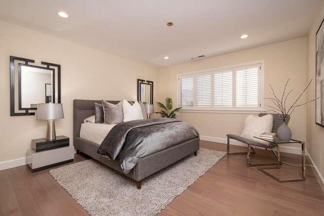 616 Ansel Road, Unit 5 Burlingame, CA 94010 - Photo 11 of 20 a bedroom with a bed and a chair
