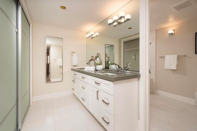 616 Ansel Road, Unit 5 Burlingame, CA 94010 - Photo 12 of 20 a bathroom with a double vanity sink and a mirror