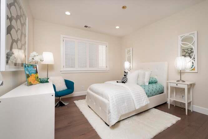 616 Ansel Road, Unit 5 Burlingame, CA 94010 - Photo 14 of 20 a bedroom with a bed table chair and a window