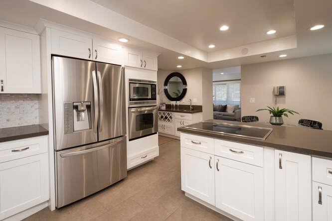 616 Ansel Road, Unit 5 Burlingame, CA 94010 - Photo 5 of 20 a kitchen with granite countertop a refrigerator and a sink