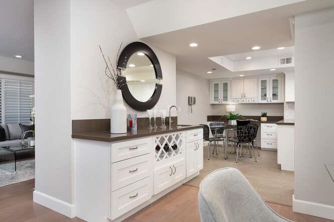 616 Ansel Road, Unit 5 Burlingame, CA 94010 - Photo 7 of 20 a kitchen with stainless steel appliances granite countertop a stove a sink a dining table and chairs