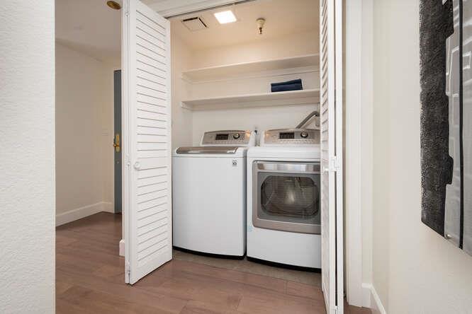 616 Ansel Road, Unit 5 Burlingame, CA 94010 - Photo 10 of 20 a view of washer and dryer with kitchen in the background