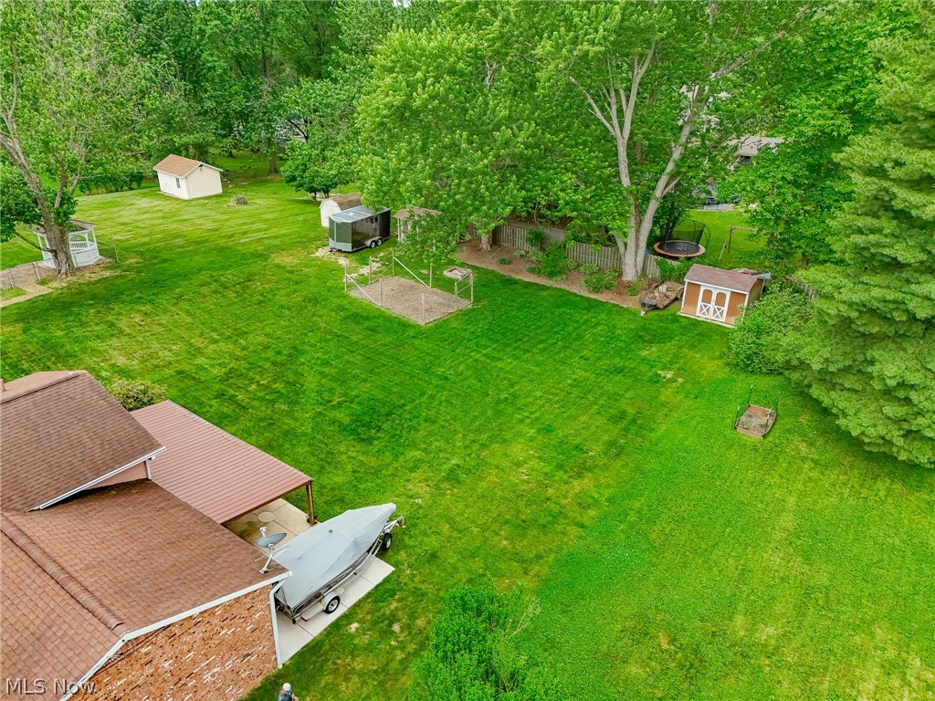 5862 Canterbury Road New Franklin, OH 44319 - Photo 34 of 45 Concrete pad for boat, 2 10 x 12 sheds for storage, enclosed garden area.