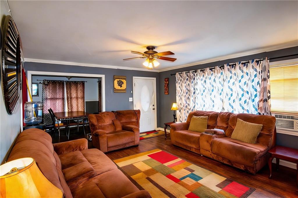154 Privette Road Southwest Marietta, GA 30008 - Photo 12 of 28 a living room with furniture and a chandelier