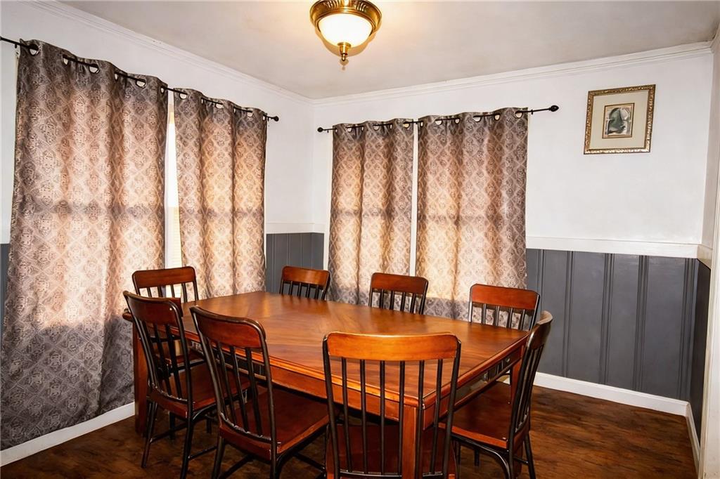 154 Privette Road Southwest Marietta, GA 30008 - Photo 15 of 28 a view of a dining room with furniture and wooden floor