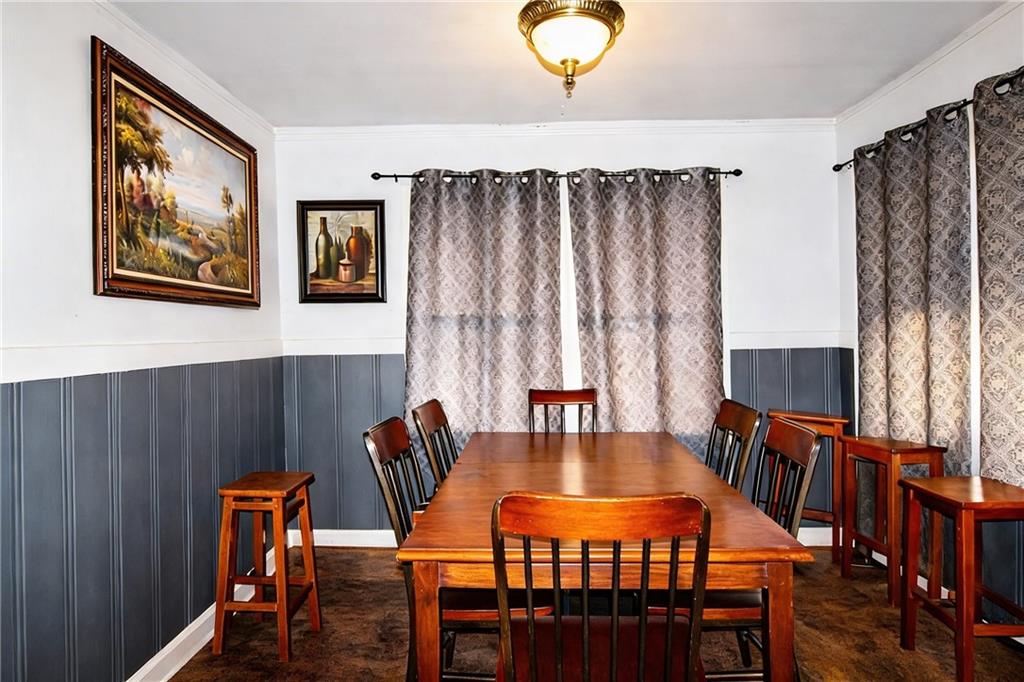 154 Privette Road Southwest Marietta, GA 30008 - Photo 16 of 28 a view of a dining room with furniture and wooden floor