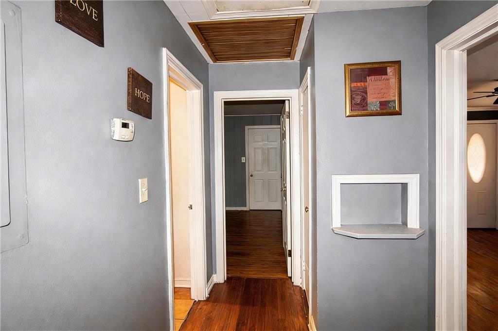 154 Privette Road Southwest Marietta, GA 30008 - Photo 17 of 28 a view of hallway with wooden floor and cabinet
