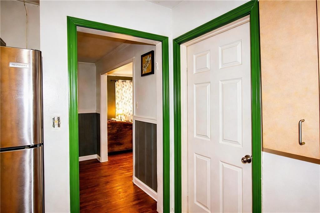 154 Privette Road Southwest Marietta, GA 30008 - Photo 19 of 28 a view of a hallway with wooden floor and closet with wooden floor