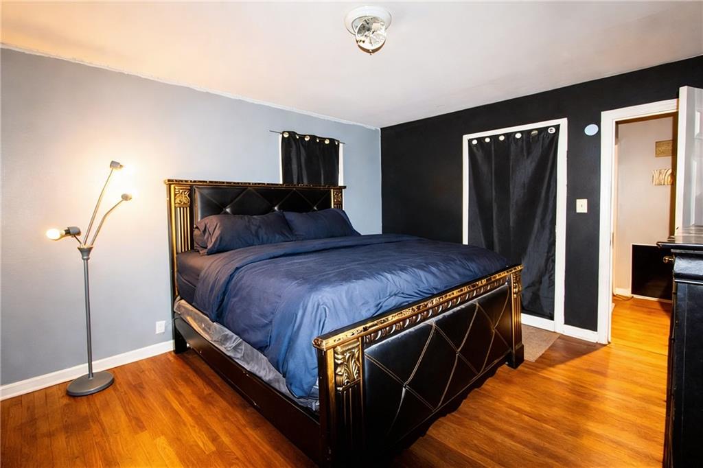 154 Privette Road Southwest Marietta, GA 30008 - Photo 27 of 28 a bed sitting in a bedroom next to a window