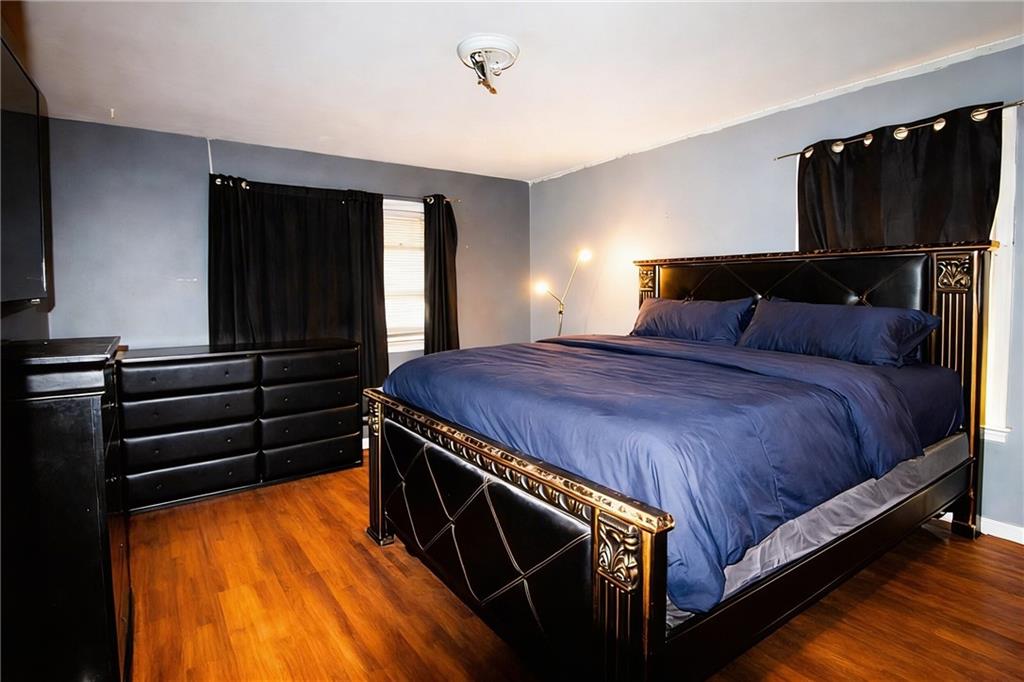 154 Privette Road Southwest Marietta, GA 30008 - Photo 28 of 28 a bed sitting in a bedroom next to a window