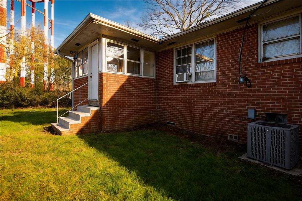 154 Privette Road Southwest Marietta, GA 30008 - Photo 5 of 28 a view of a house with backyard and deck