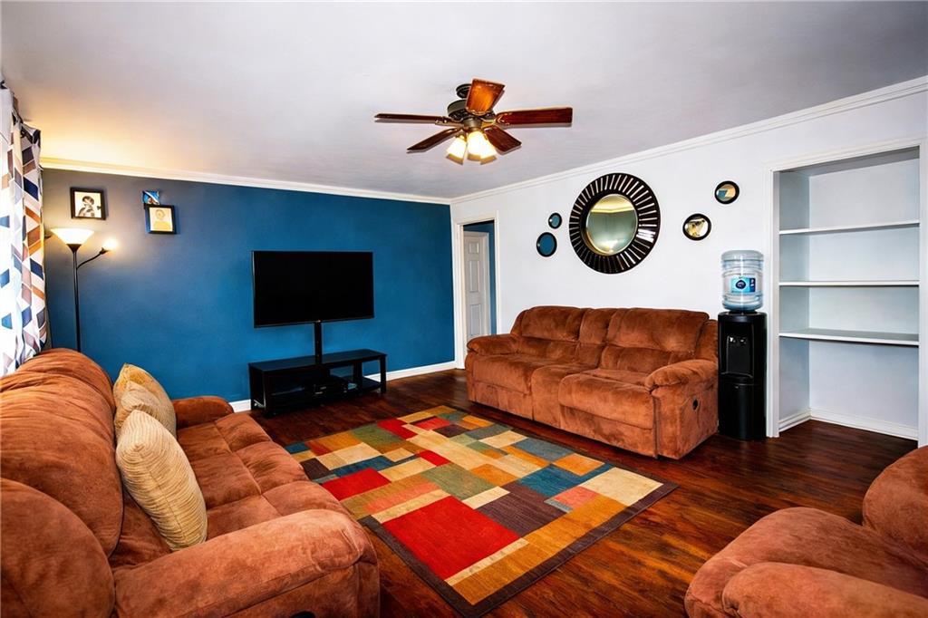154 Privette Road Southwest Marietta, GA 30008 - Photo 10 of 28 a living room with furniture and a lamp