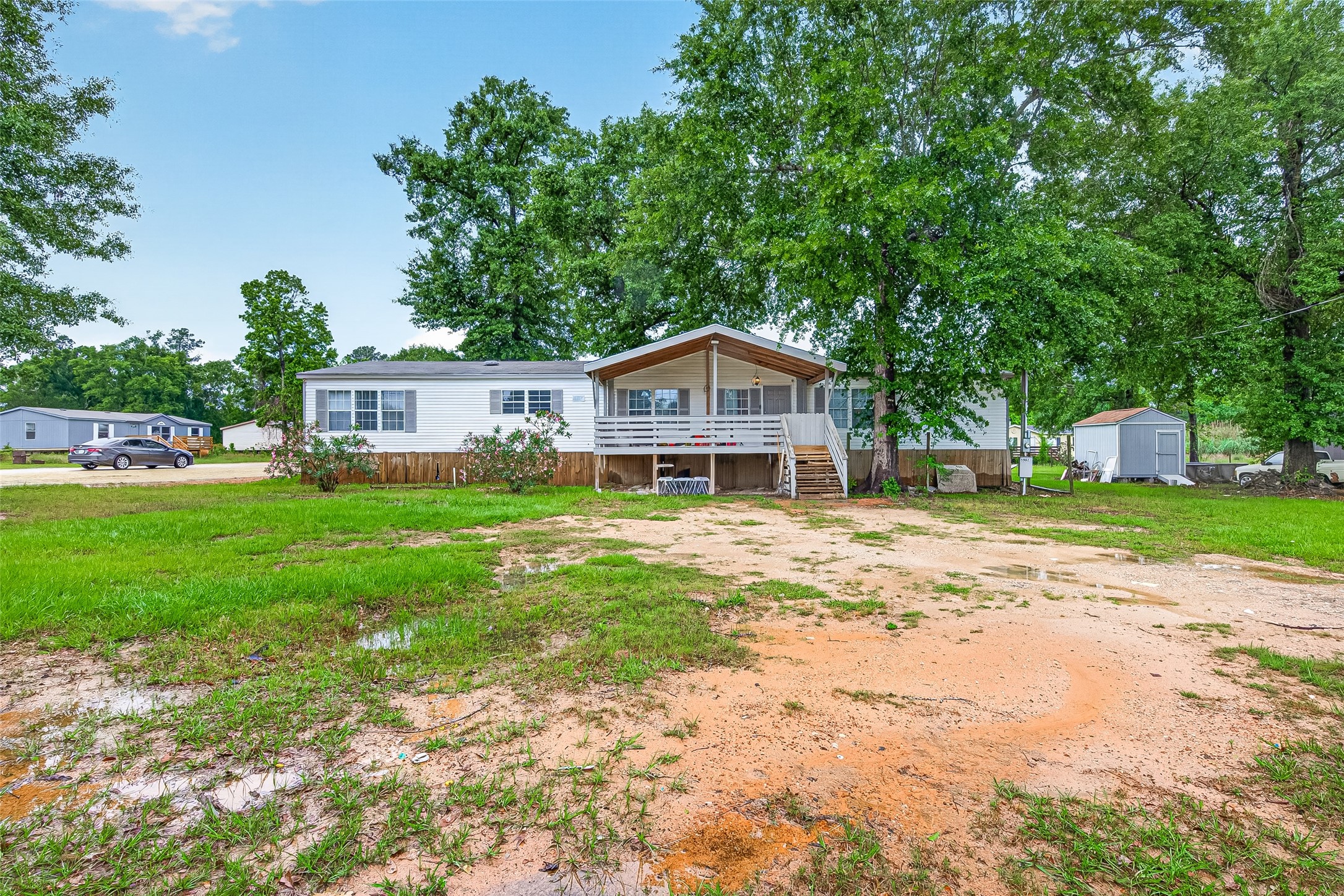 5982 Waukegan Road Conroe, TX 77306 - Photo 1 of 49 a house with garden in front of it