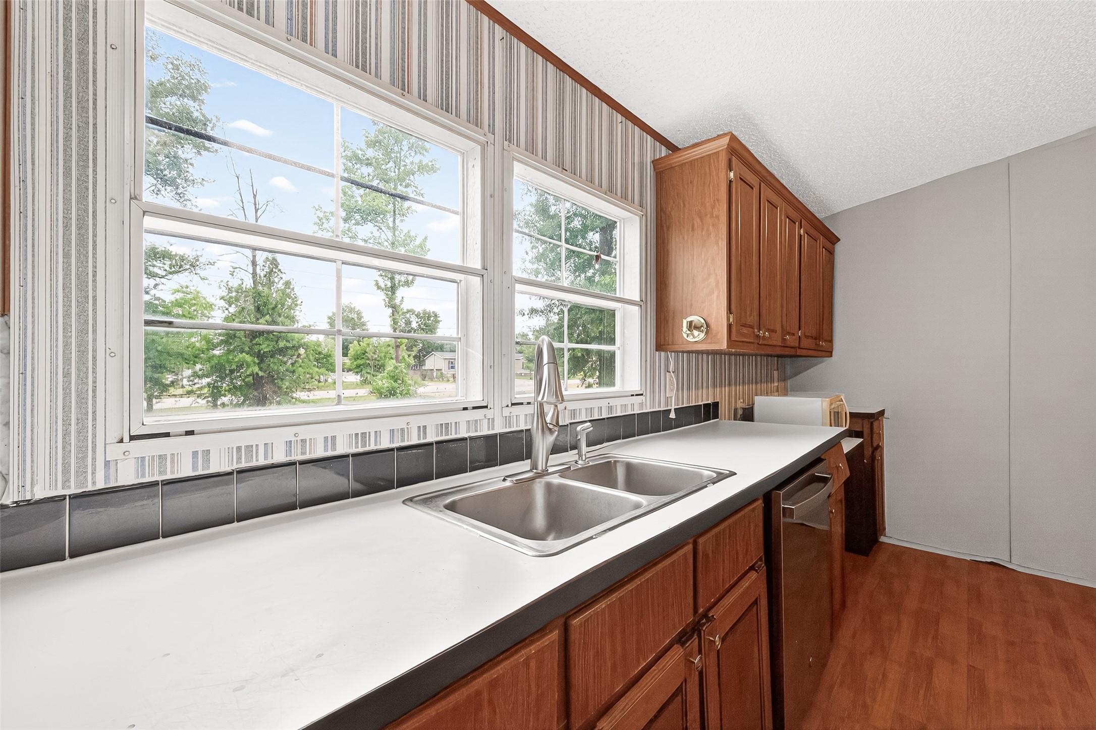 5982 Waukegan Road Conroe, TX 77306 - Photo 20 of 49 a kitchen that has a sink a window and cabinets