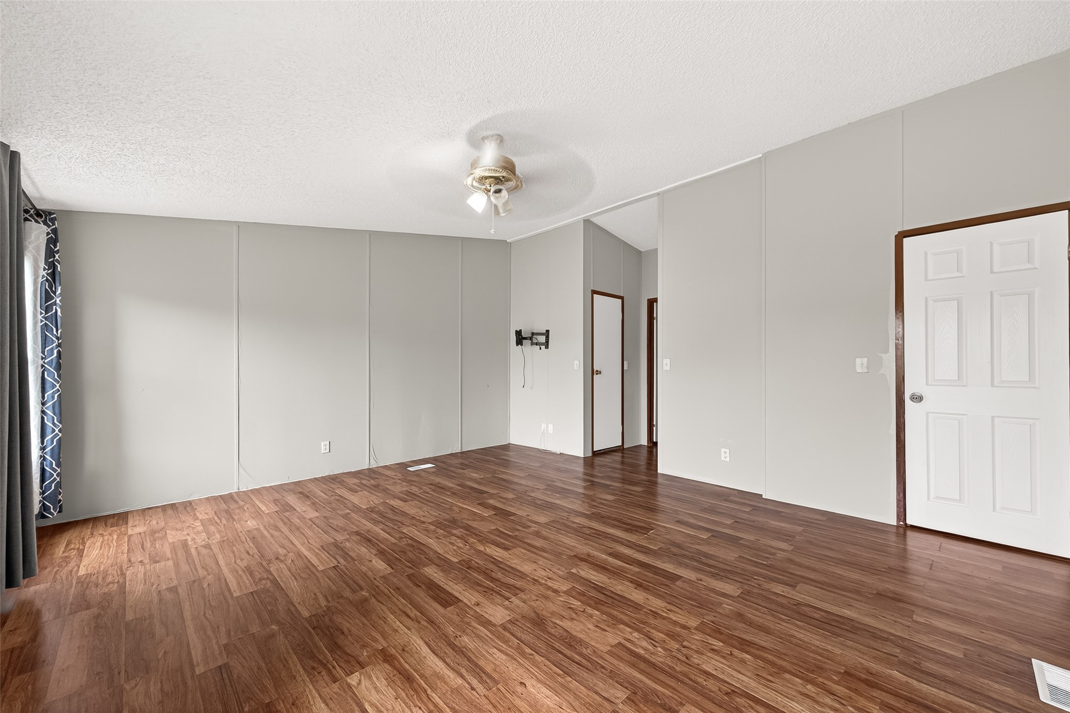 5982 Waukegan Road Conroe, TX 77306 - Photo 26 of 49 a view of an empty room with wooden floor