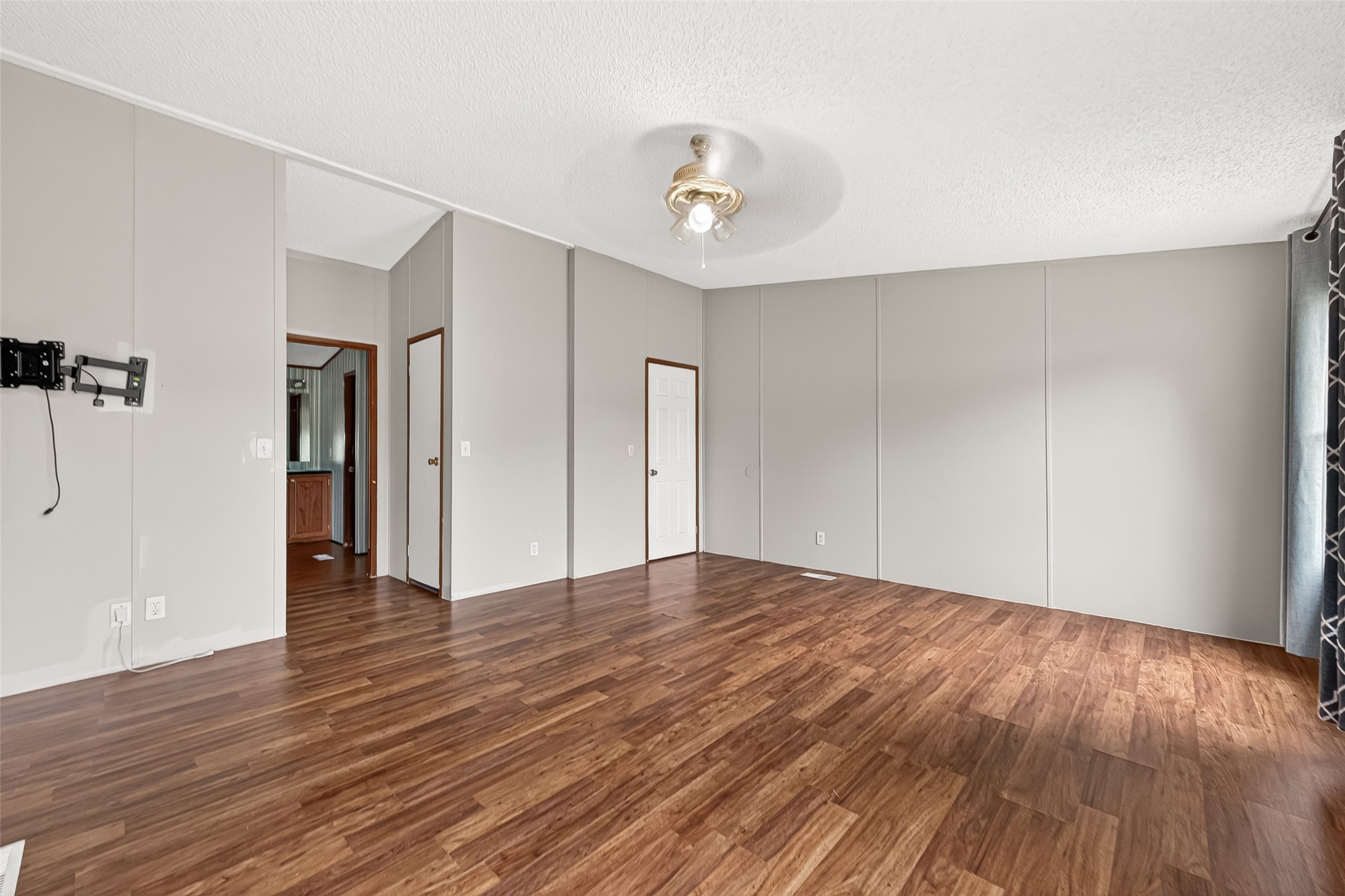5982 Waukegan Road Conroe, TX 77306 - Photo 27 of 49 a view of an empty room with wooden floor and a window
