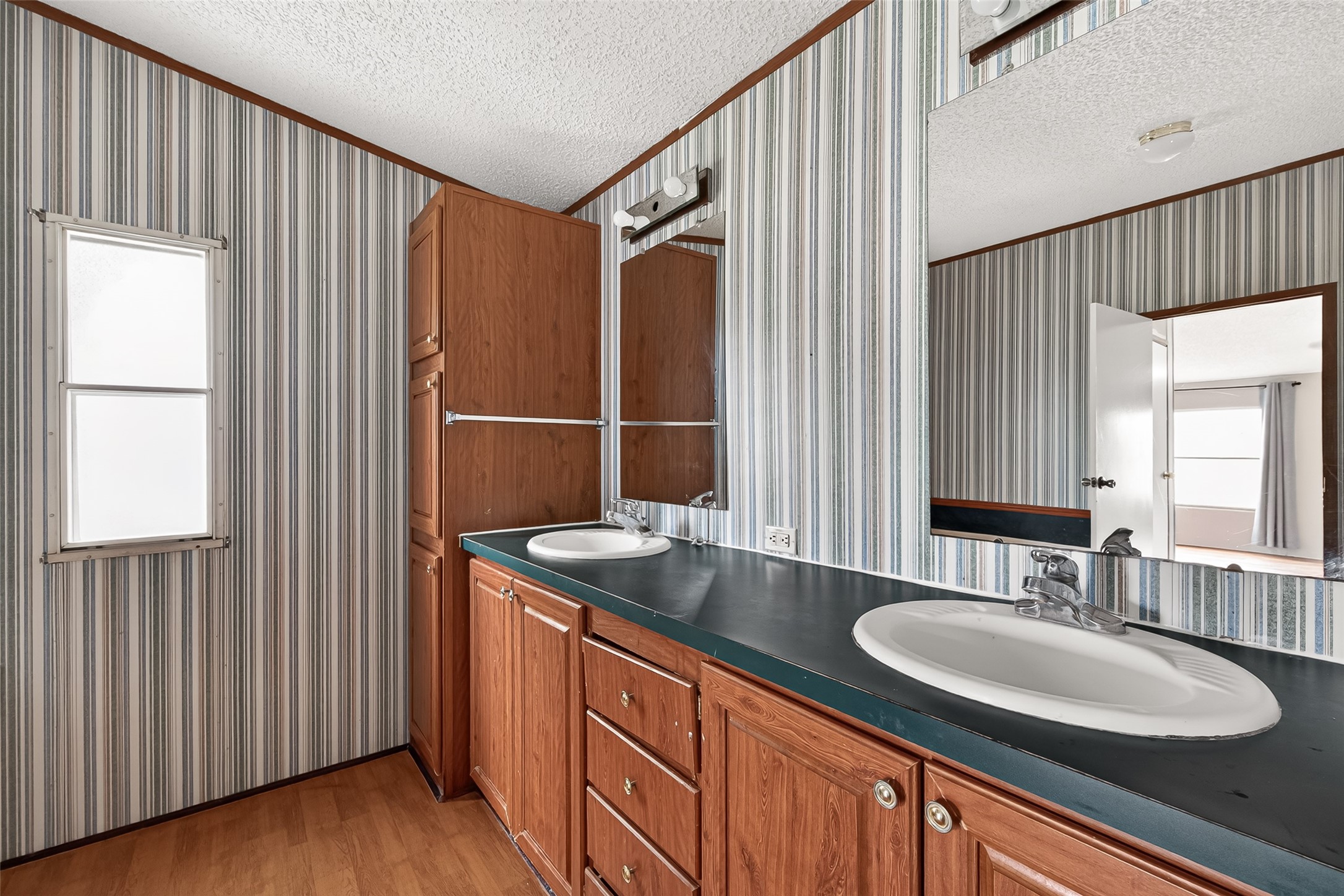 5982 Waukegan Road Conroe, TX 77306 - Photo 29 of 49 a bathroom with a sink double vanity and a mirror