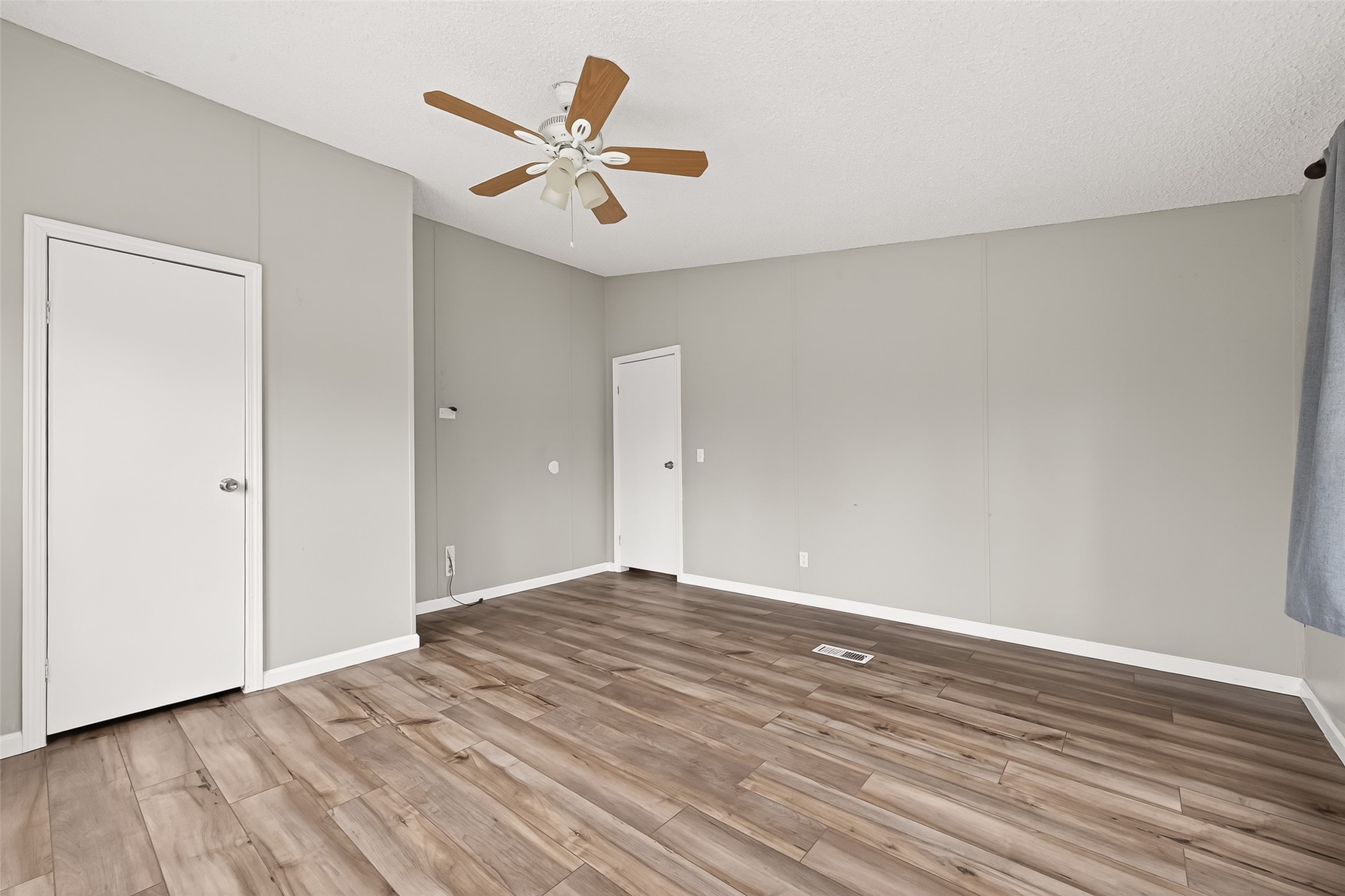 5982 Waukegan Road Conroe, TX 77306 - Photo 38 of 49 a view of empty room with wooden floor