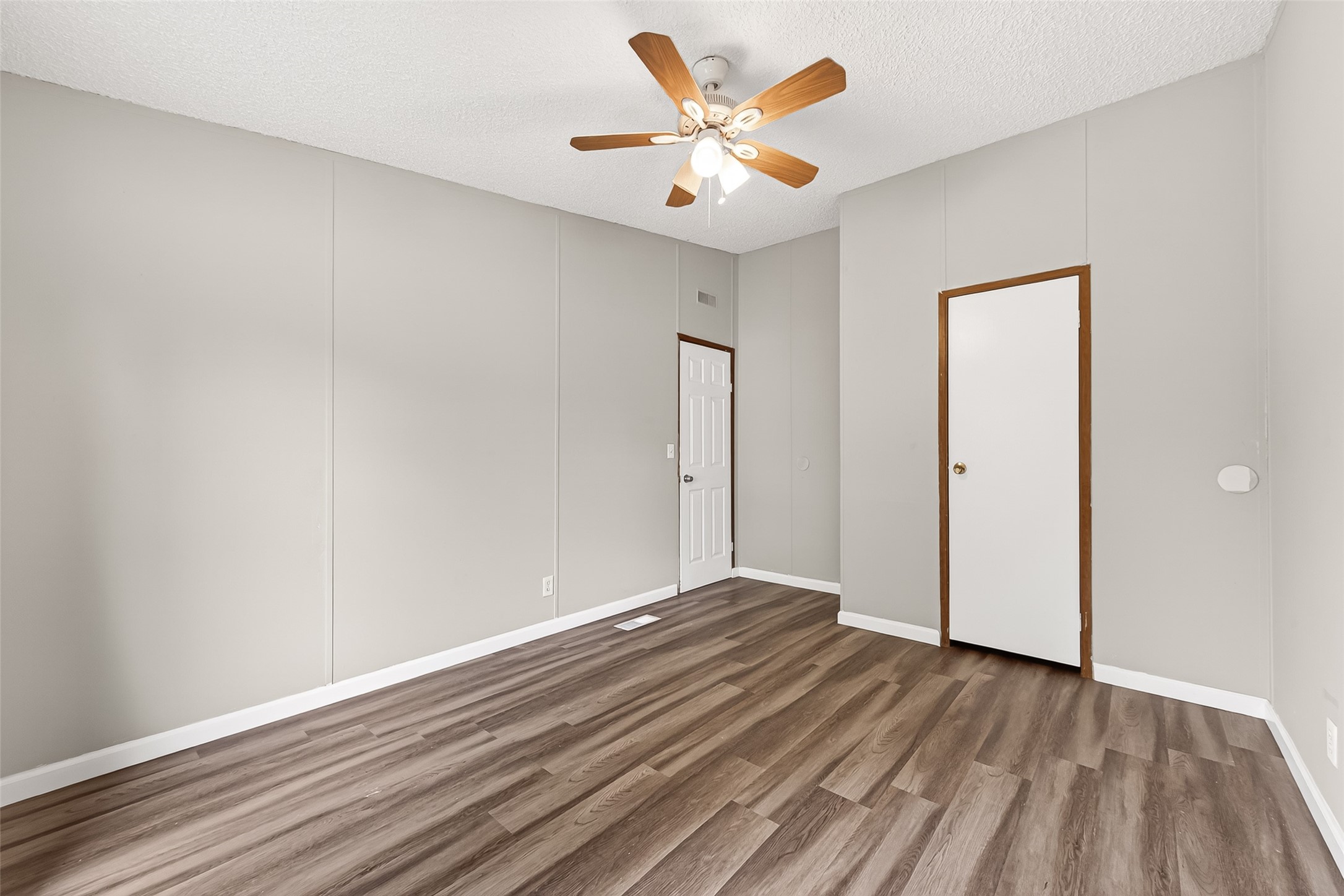 5982 Waukegan Road Conroe, TX 77306 - Photo 40 of 49 a view of an empty room and wooden floor