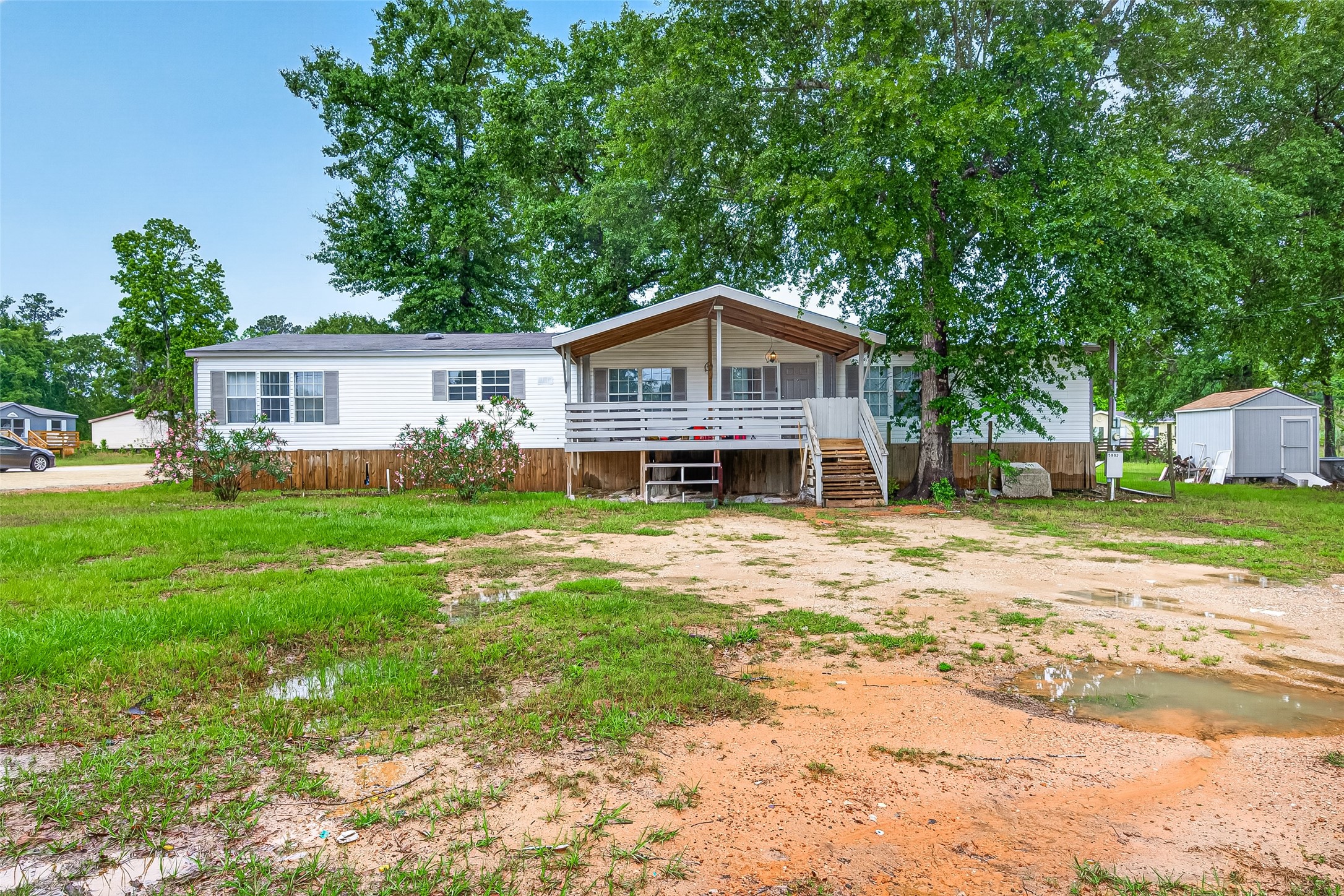5982 Waukegan Road Conroe, TX 77306 - Photo 4 of 49 a front view of a house with garden