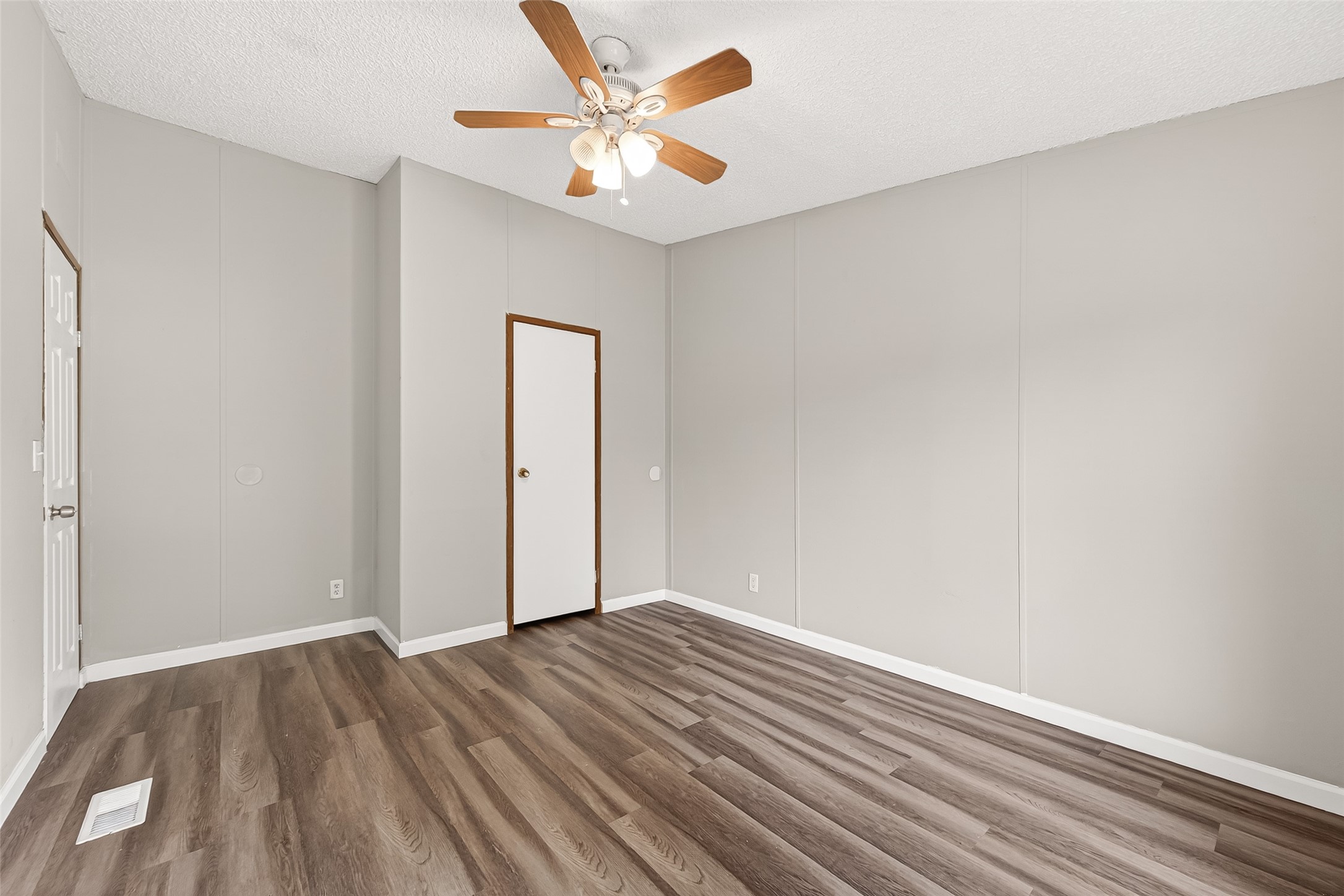 5982 Waukegan Road Conroe, TX 77306 - Photo 41 of 49 wooden floor in an empty room
