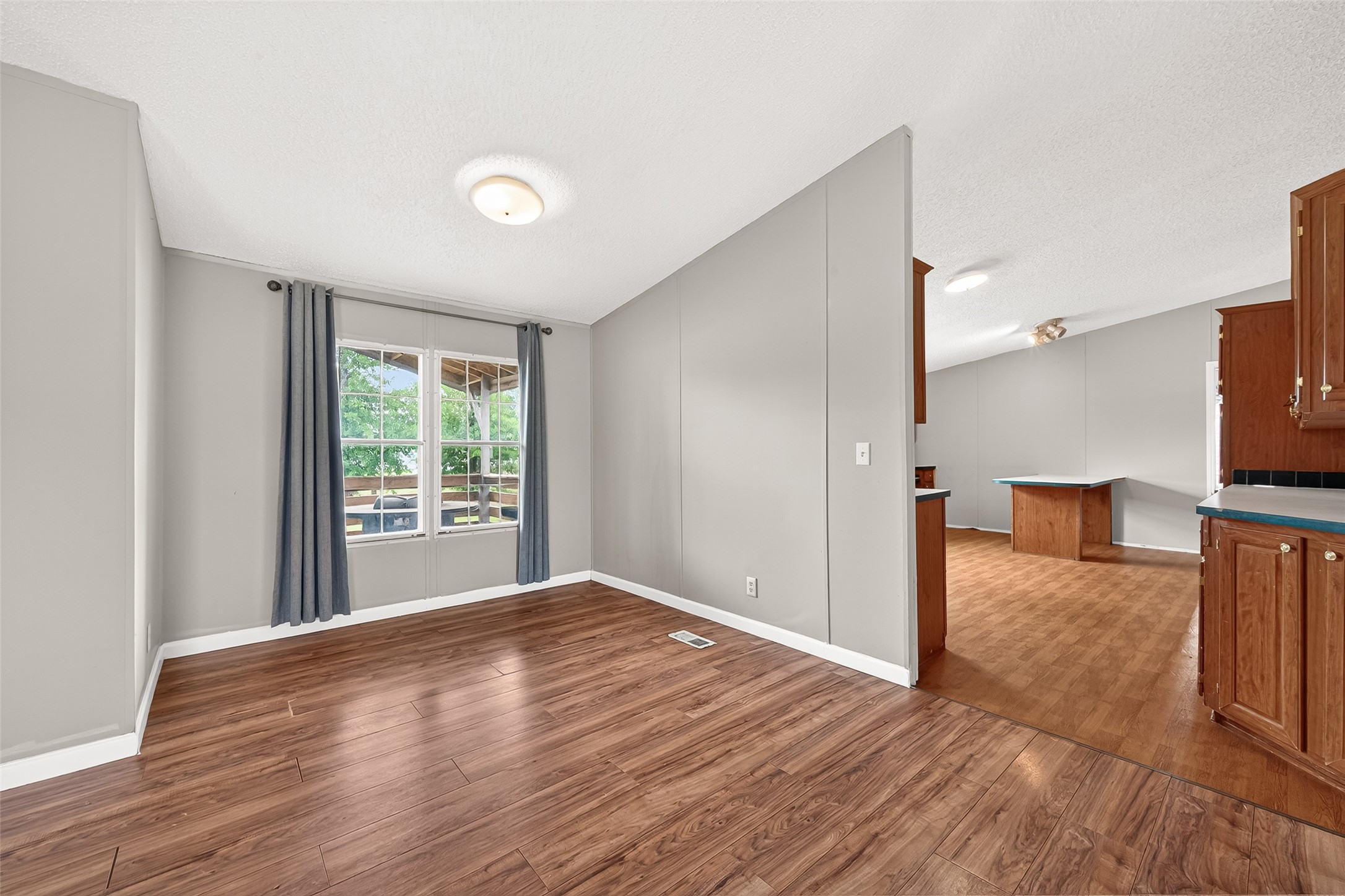 5982 Waukegan Road Conroe, TX 77306 - Photo 9 of 49 a view of a livingroom with wooden floor