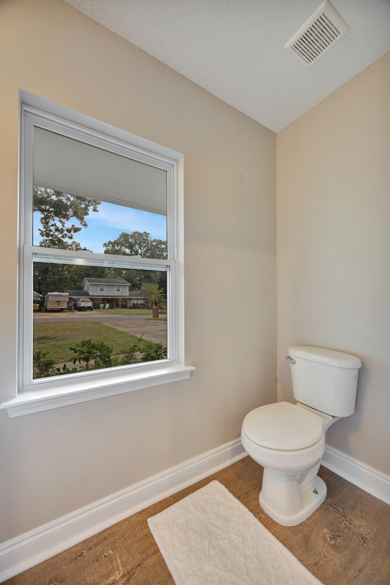 147 Gillis Drive Crestview, FL 32536 - Photo 22 of 62 a white toilet sitting next to a window