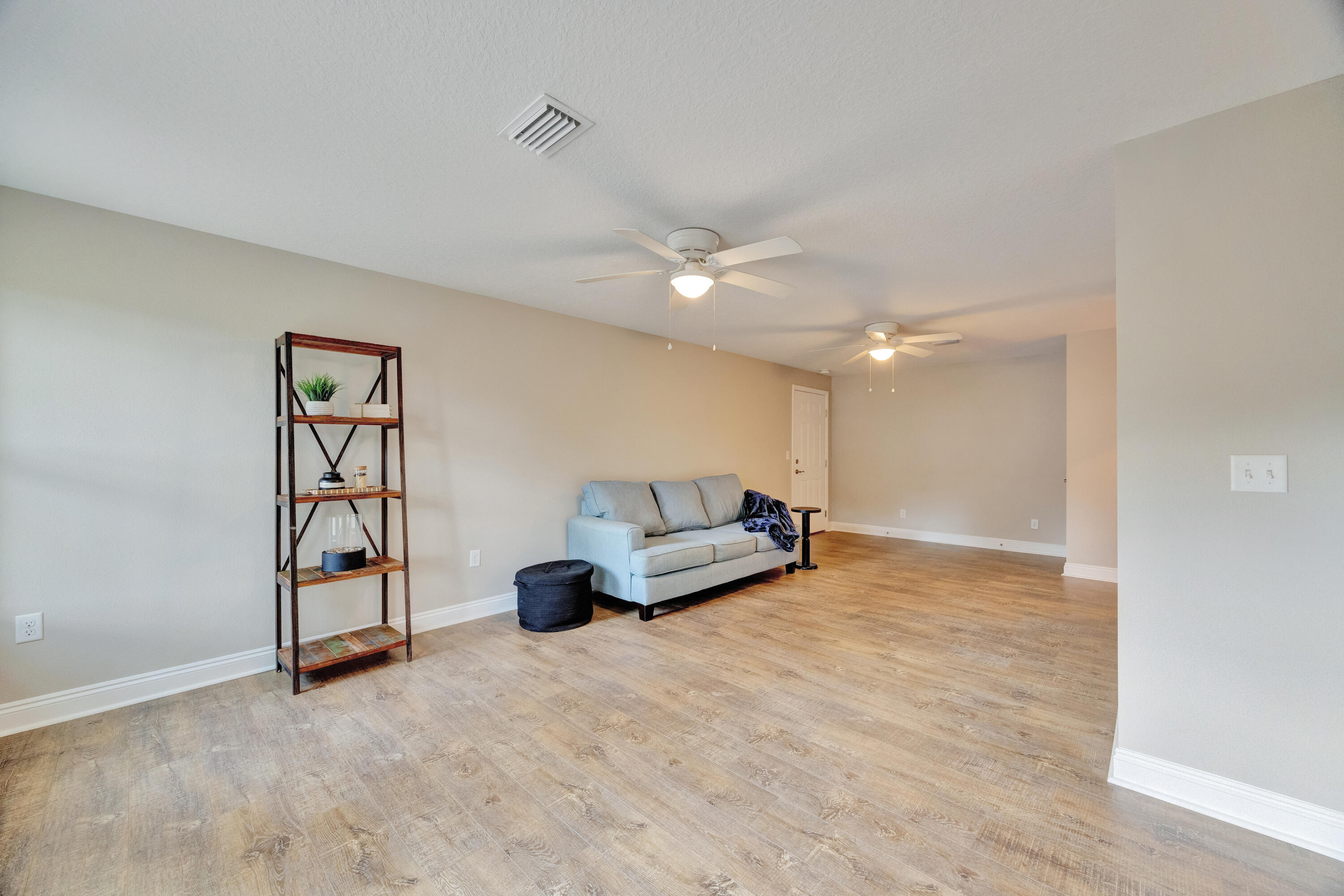 147 Gillis Drive Crestview, FL 32536 - Photo 23 of 62 a living room with furniture a ceiling fan and a window