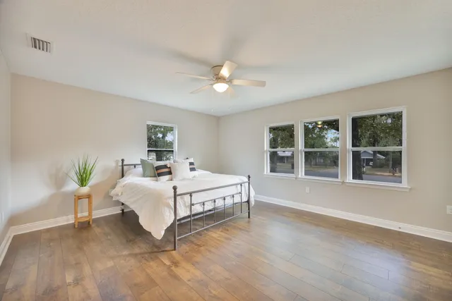 a view of a room with rack on the wall and a window