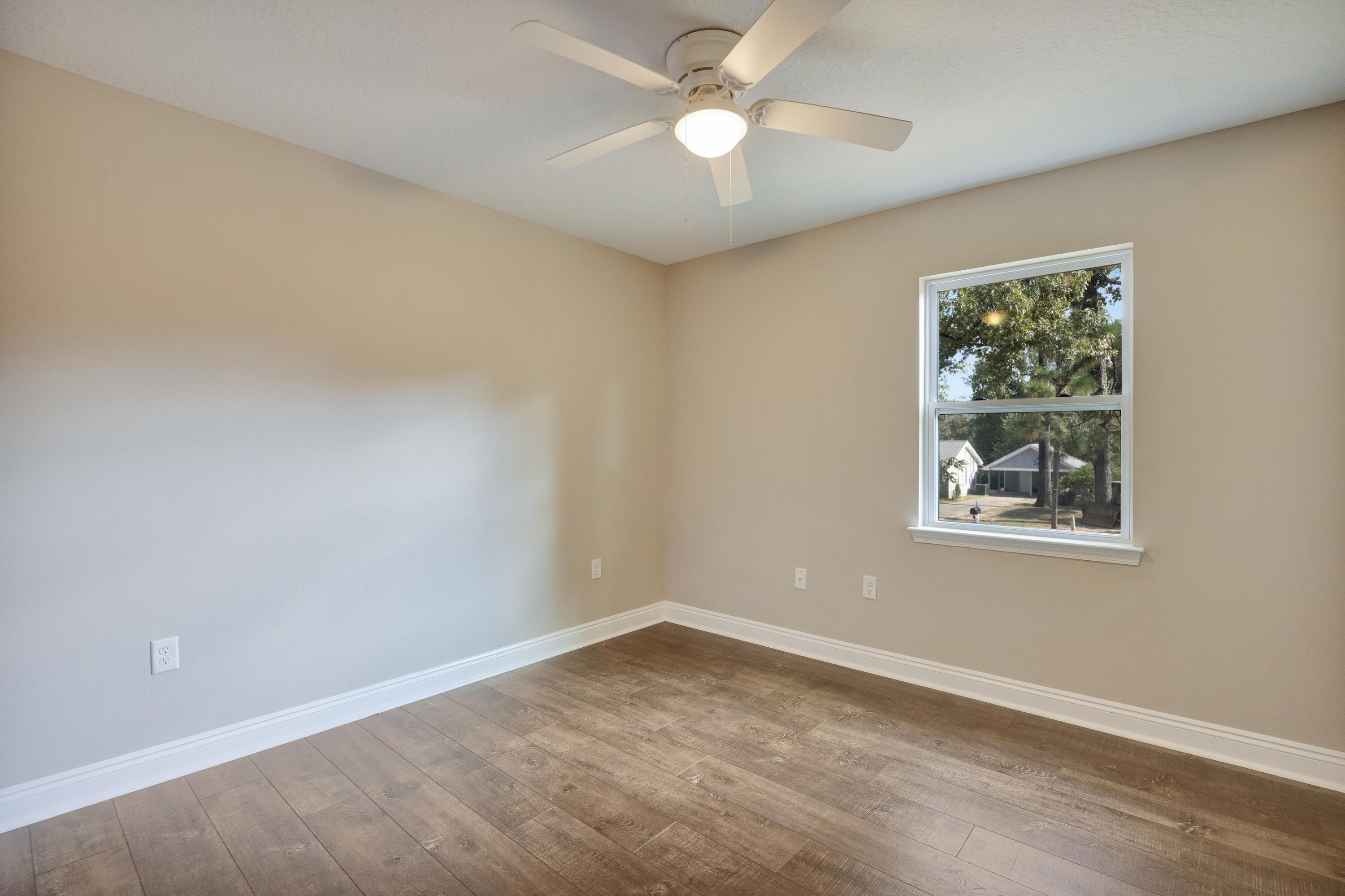 147 Gillis Drive Crestview, FL 32536 - Photo 39 of 62 an empty room with a window and a fan