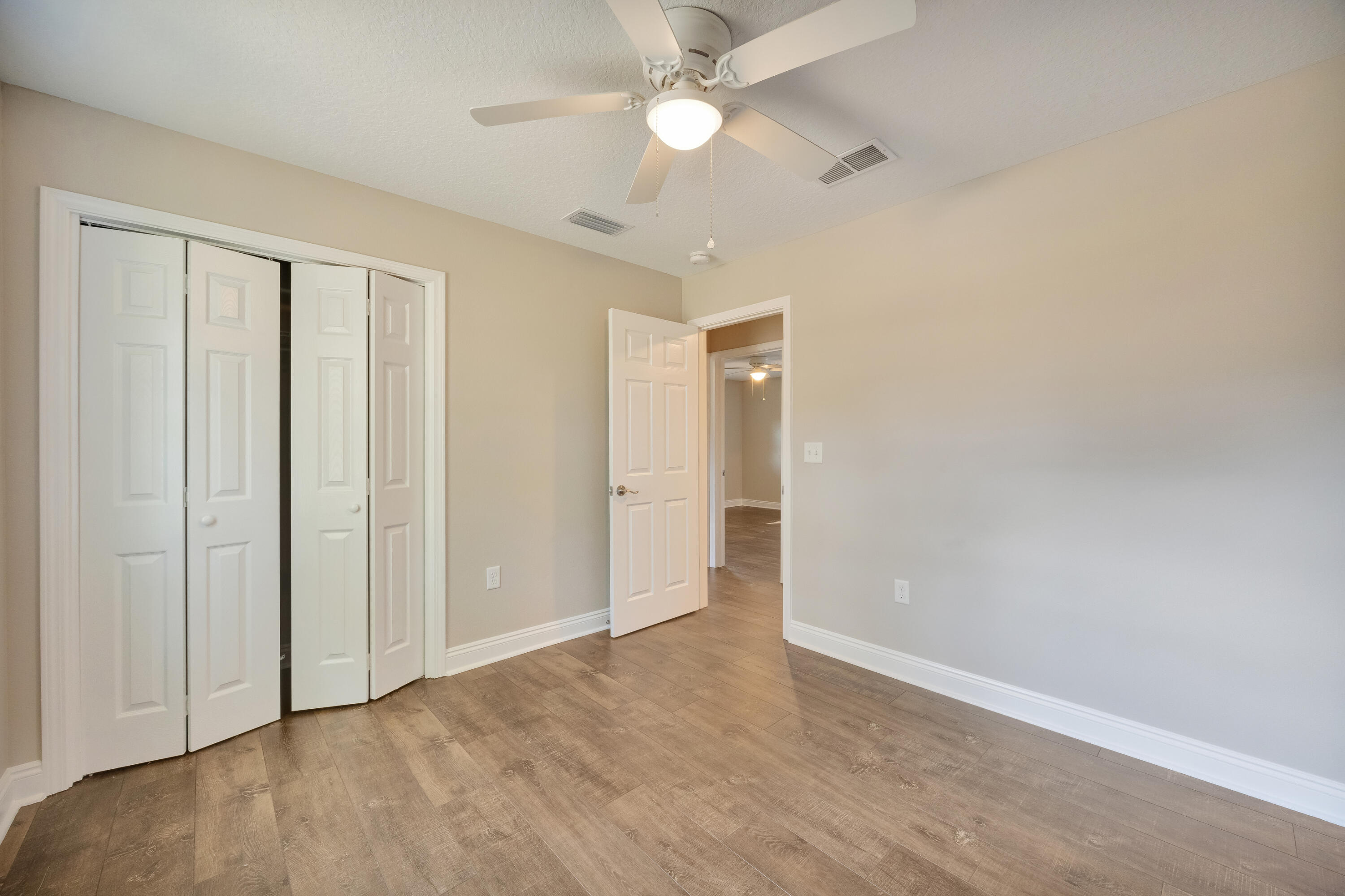 147 Gillis Drive Crestview, FL 32536 - Photo 40 of 62 wooden floor in an empty room