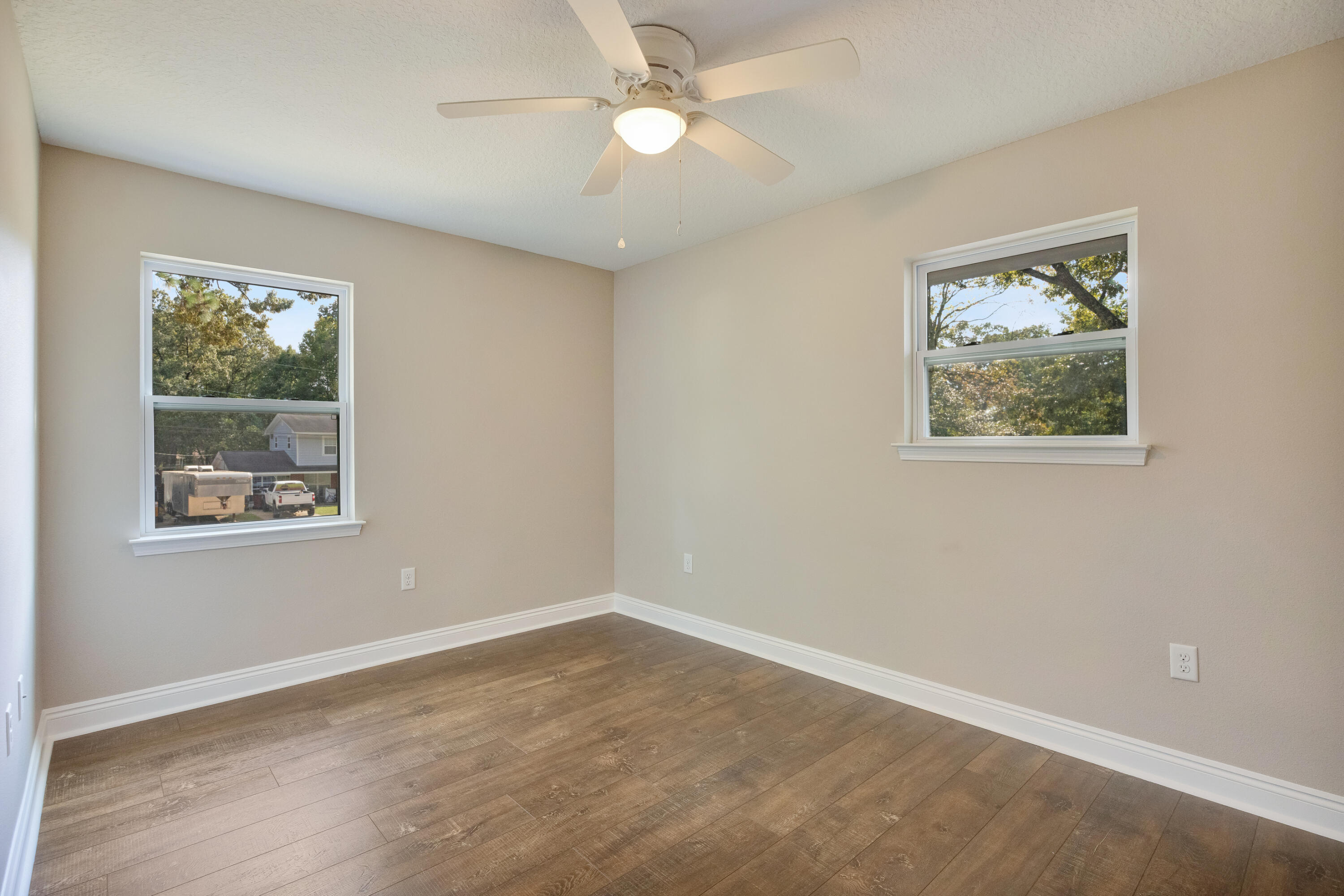 147 Gillis Drive Crestview, FL 32536 - Photo 41 of 62 a view of an empty room with a window and a ceiling fan