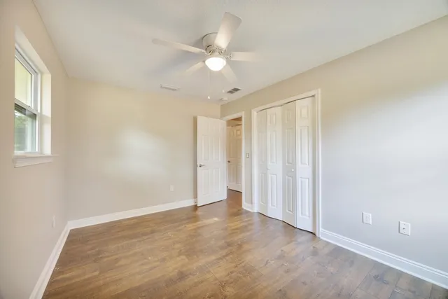 a view of an empty room with a balcony