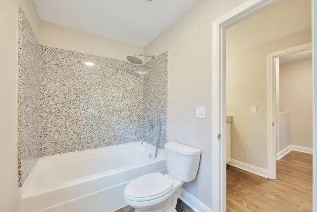 a view of a house with a yard and tree s