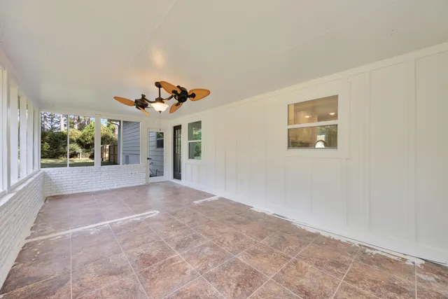 an aerial view of a house with a yard and garden