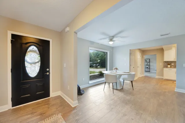 a view of a livingroom with furniture and chandelier