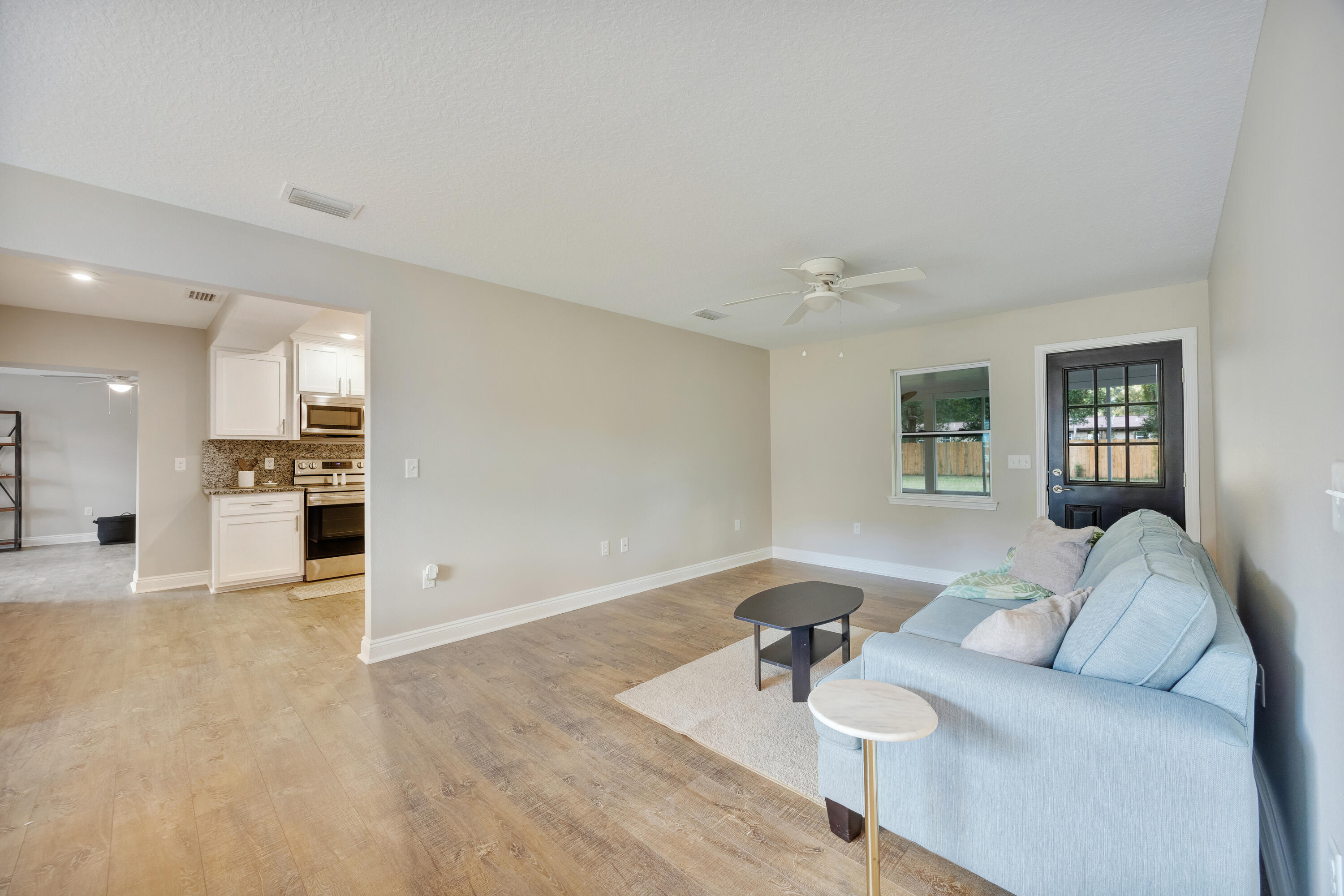 147 Gillis Drive Crestview, FL 32536 - Photo 6 of 62 a living room with furniture and a open kitchen
