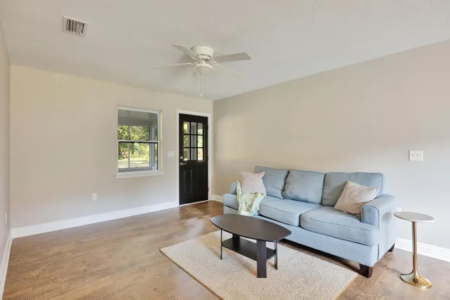 a living room with furniture and a window