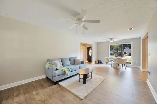 a living room with furniture and a table